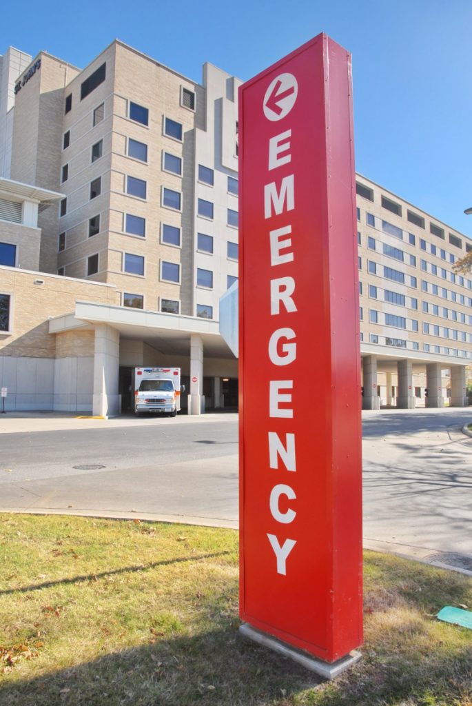 Red emergency sign outside a hospital